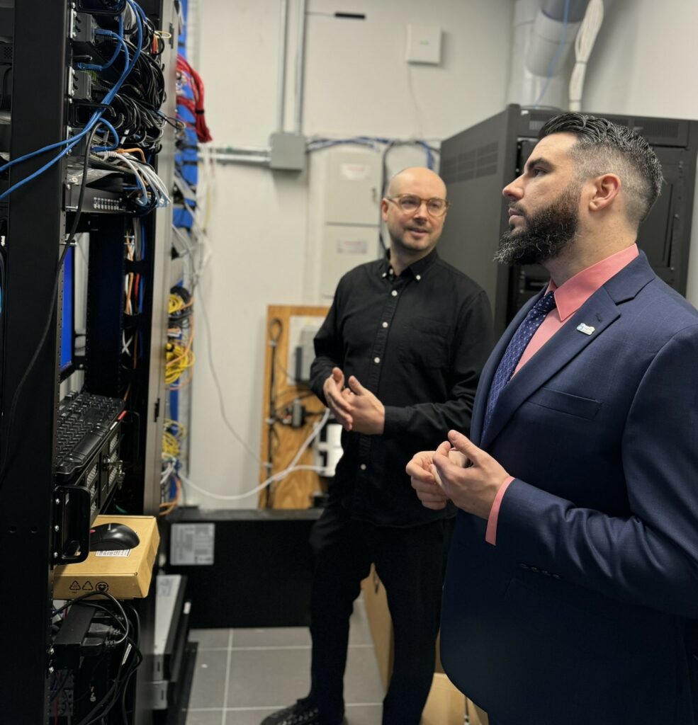 Kyle Cassidy from Agilis networks telecommunications provider with Darryl B from Palladino in a server room talking about colocation