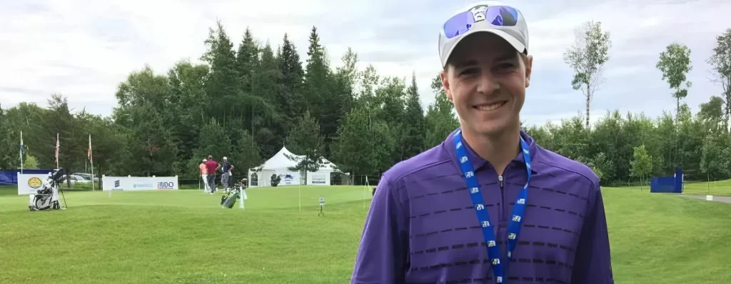 A portrait of Dustin Barr on a golf course